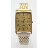 A Vintage Avia 9K Gold Cased Watch. Gilded strap. Gold rectangular case - 33 x 23mm. Dial is worn on