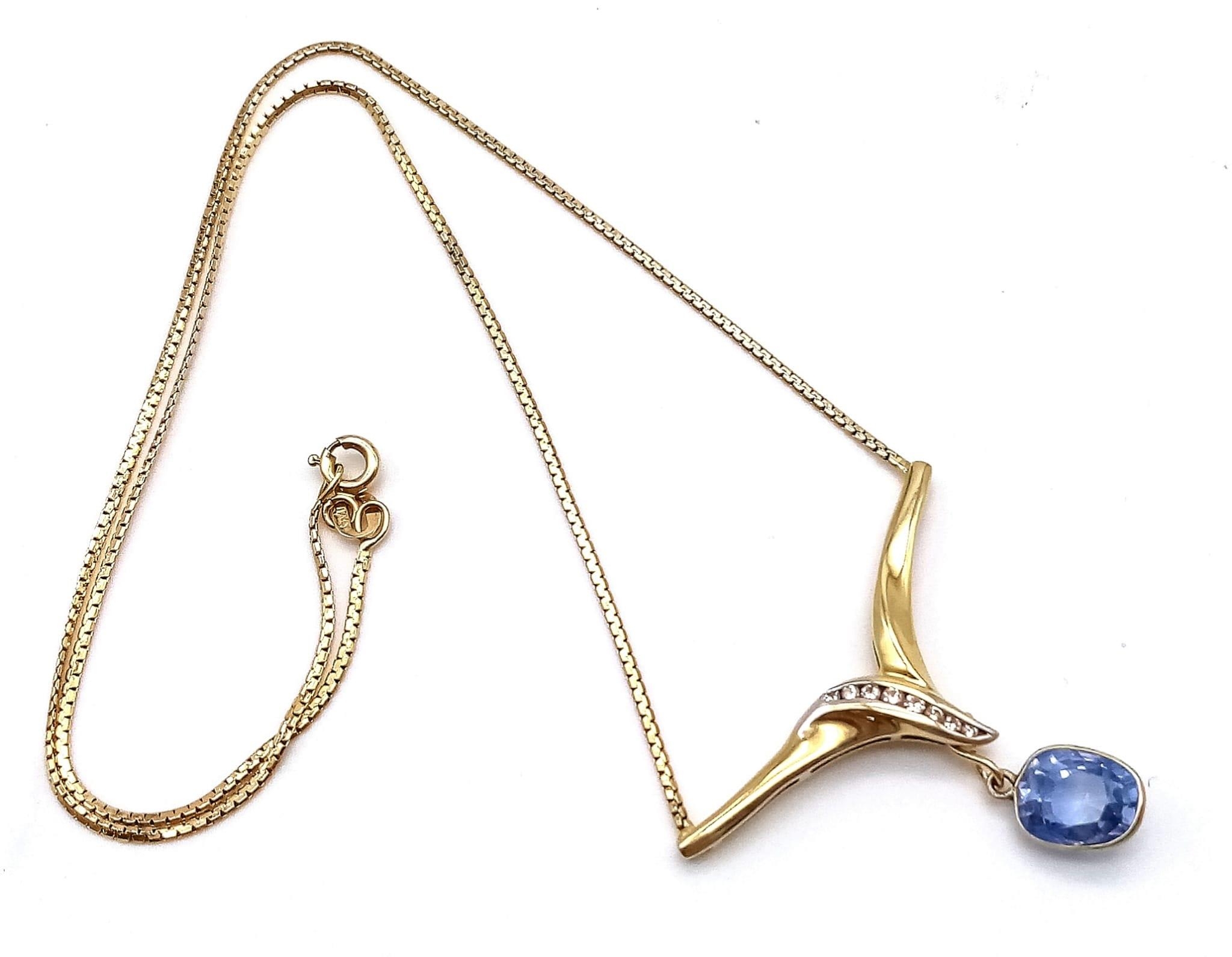 An Elegant 18K Yellow Gold Sapphire and Diamond Necklace. A delicate gold necklace with chevron