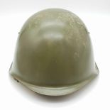 A 1980s Soviet Army Hard Steel Helmet. Leather strap and inner.