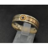 A 14K Yellow Gold Band Ring with Three Garnet Stones. Size T. 6.5g total weight. Ref 1157.
