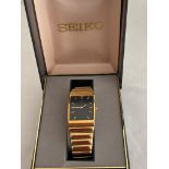 Vintage Gentlemans SEIKO 5Y39 5140 wristwatch. Having black square face with golden digits and