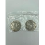 Two World War II SILVER HALF CROWNS in extra fine condition, having bold and raised definition to