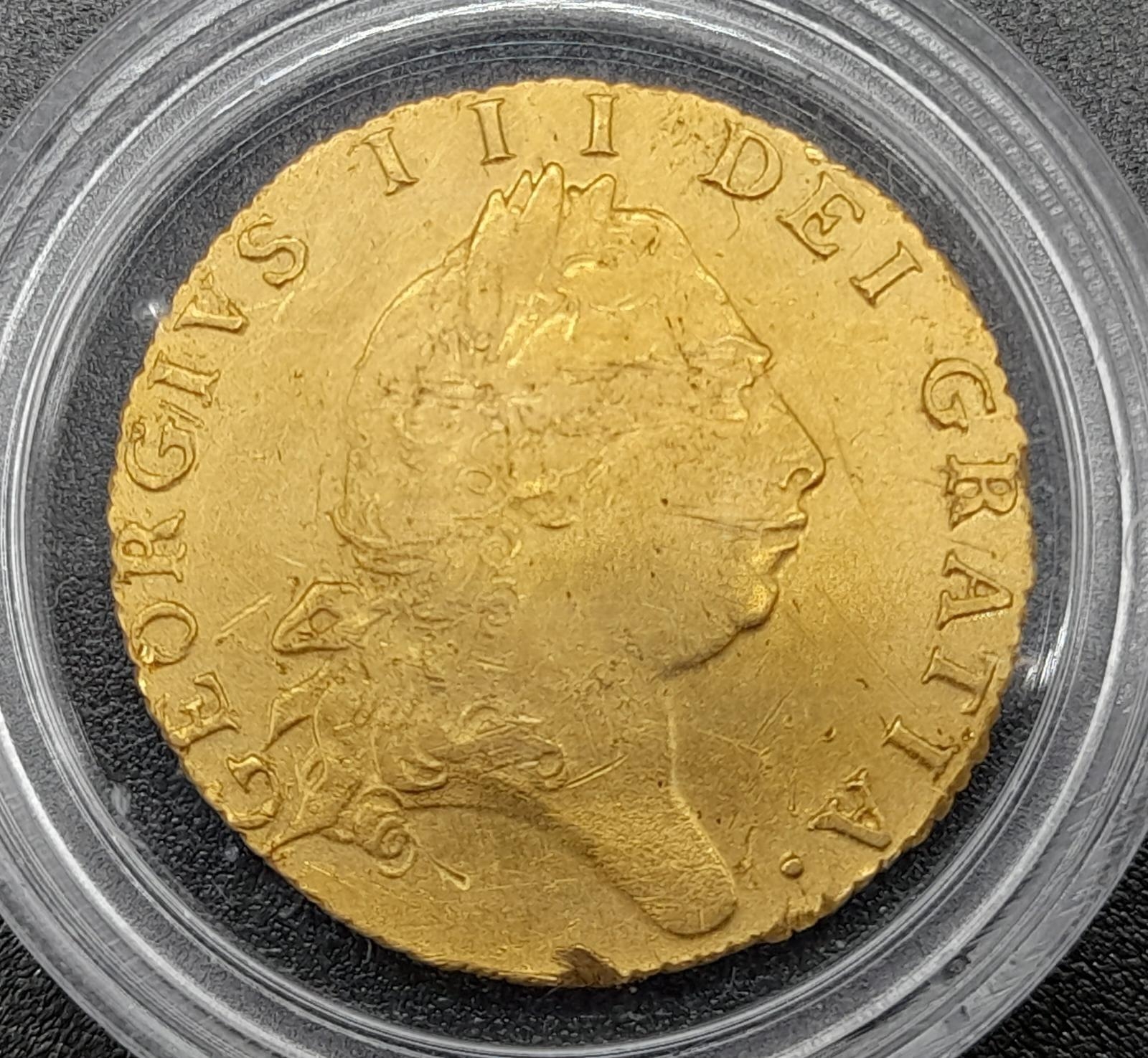 A 1779 George III Half Guinea 22K Gold Coin. VF condition but please see photos. 4.2g. - Image 2 of 4
