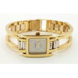 A 14K Yellow and White Gold Geneve Quartz Ladies Watch. 14k gold strap and case - 22 x 16mm. White