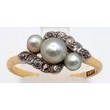 An Edwardian 18K Yellow Gold, Platinum, Natural Pearl and Diamond Ring. Crossover design.