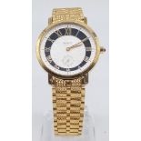 A 21K yellow gold GENIVE gents watch . 33 mm dial with white and black face, gold hands and Roman