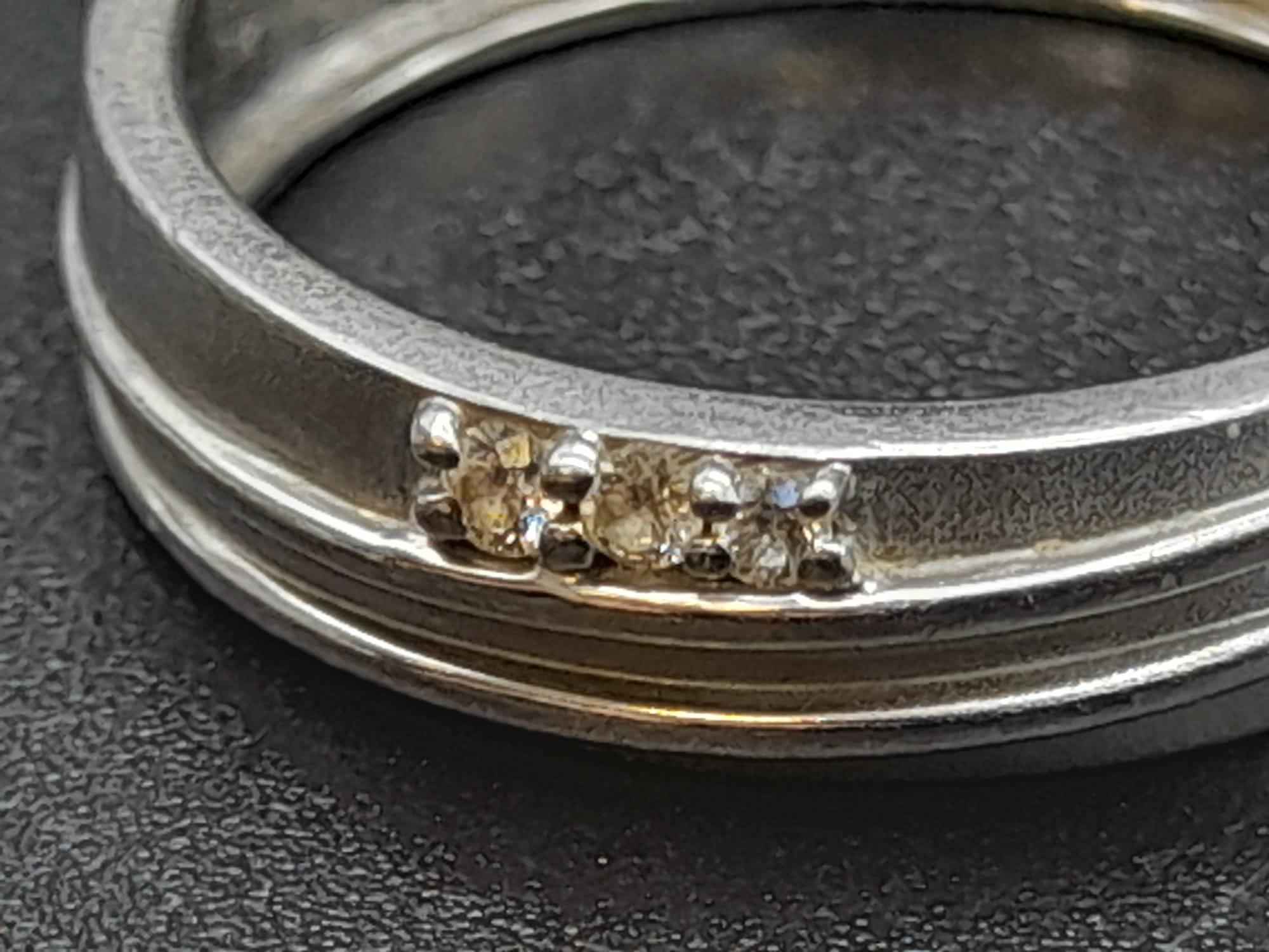 A 950 Platinum Diamond Band Ring. Three small diamonds. Size Q. 5.19g total weight. Ref - 190 - Image 3 of 12