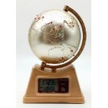A Global World Time Zone Desk Clock. Move the globe to see different world times. In good