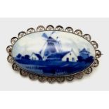 An Antique Delft Ceramic Blue and White Brooch set in Silver. 5cm.