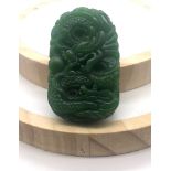 A Green Jade Dragon-Image Carved Pendant. 5cm.