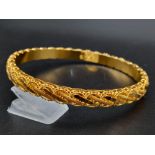 An 21K Yellow Gold Fancy-Design Bangle. Perfect wedding jewellery. 6.5cm inner diameter. 13.2g.