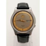 A Vintage Seiko 5 Automatic Gents Watch. Black leather strap with two tone metal case - 34mm. Two-