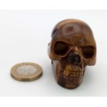 A Hand-Carved Tigers Eye Crystal Skull Figure. Perfect as an ornament or small paperweight. 5 x 4cm