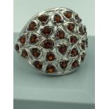 Stunning SILVER RING cluster set with Garnet red gemstones . Complete with ring box. Size R 1/2 - S.