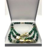 An Elaborate White Keisha Pearl, Green Tigers Eye and Banded Green Agate Three-Row Necklace.