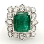 A WGI Certified 18K White Gold Emerald and Diamond Ring. A 4.1ct centre cut natural emerald