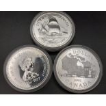 Three Uncirculated Canadian Silver Dollars in Original Presentation Cases.