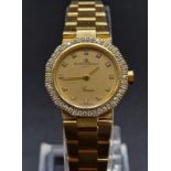 A Baume and Mercier 18K Gold and Diamond Ladies Quartz Watch. 18k gold bracelet and case - 20mm.
