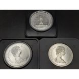 Three Uncirculated Canadian Silver Dollars in Original Presentation Cases.