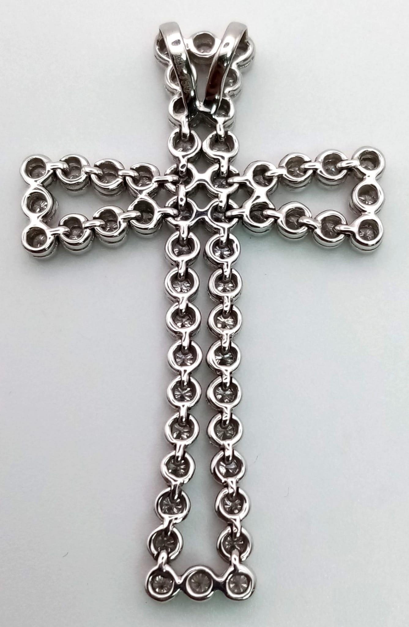 An 18K White Gold Diamond Cross Pendant. 5ct of exceptional bright round-cut diamonds create a - Image 2 of 4