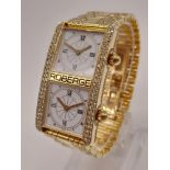 A Rare Roberge Dual Face 18K Gold and Diamond Encrusted Dress Watch. 18k gold and diamond bracelet