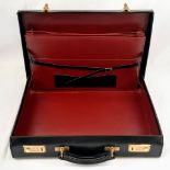 A Simpson of London Black Leather Attaché Case. Unused but some small signs of shop wear and tear.