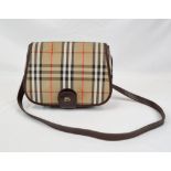 A Classic Burberry London Haystack Check and Leather Crossbody Bag. Zipped interior compartment.