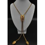 An 18K Yellow Gold Muscle Shell Decorative Chain. Main chain with larger shell pendant - two smaller