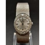 An 18K White Gold and Diamond Omega Ladies Dress Watch. 18K Gold strap and case - 22mm. Silver