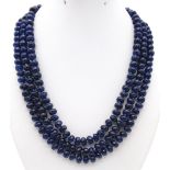 A substantial three strand multifaceted blue sapphire necklace. Length: 48-54 cm, weight: 112g.