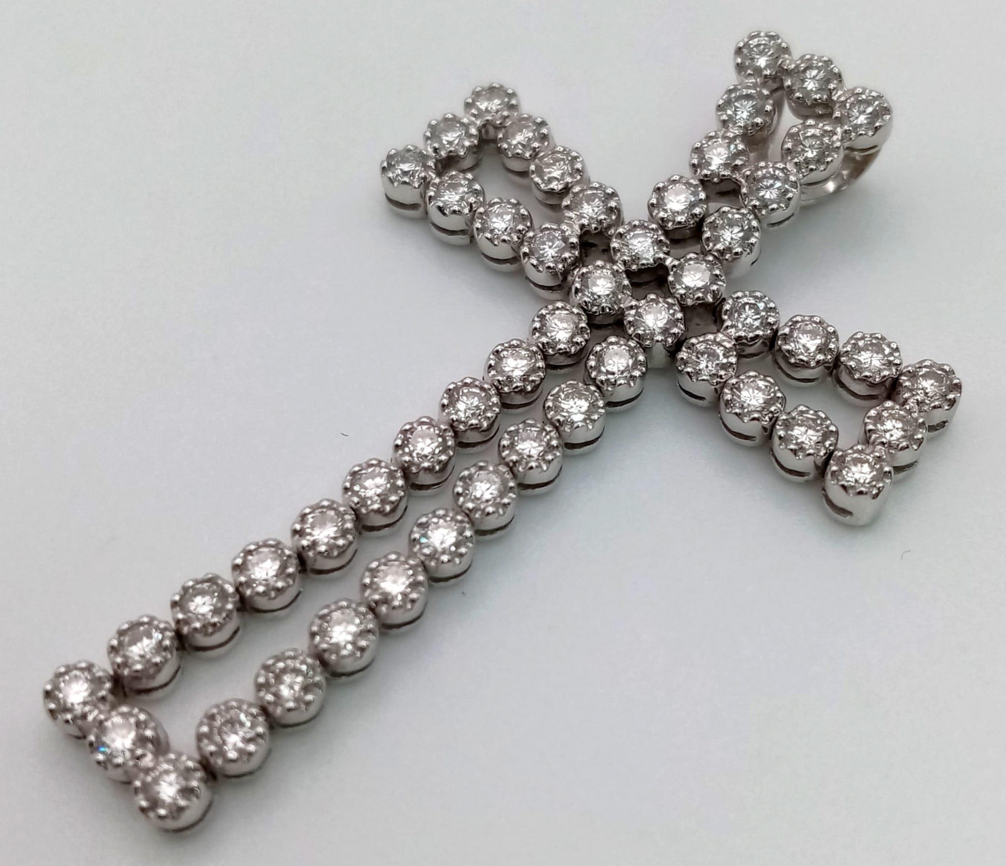 An 18K White Gold Diamond Cross Pendant. 5ct of exceptional bright round-cut diamonds create a - Image 3 of 4