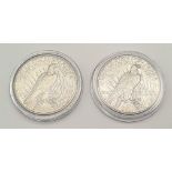 A 1922 and a 1923 Silver American Peace Dollar Coin.