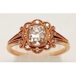 A VINTAGE STYLE 18K ROSE GOLD CUSHION CUT DIAMOND RING WITH LARGE CENTRE DIAMOND AND DIAMOND