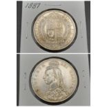 An 1887 Half Crown Queen Victoria Silver Coin. High grade but please see photos.