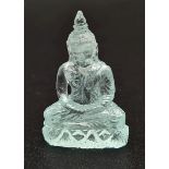 A Carved Natural Aquamarine Buddha Figure. 19.47ct. 28 x 18mm. Anchor gem lab certificate.