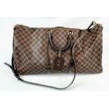 A Louis Vuitton Keepall Bandouliere Travel Bag. Checked canvas design with brown leather and
