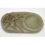 An antique Chinese jade with a tree and flowers carving. 151.5 grams. 11x6cm.