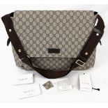 A Gucci GG Supreme Coated (baby care) Canvas Bag. GG monogrammed coated canvas. Features exterior