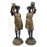 An antique pair of 19th century Louis Hottot blackamoor bronze candlesticks. 36 and 37cm tall. Total