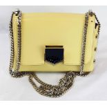A Jimmy Choo Lockett Leather Shoulder Bag. Calfskin leather with a suede lining. Silver-tone studs