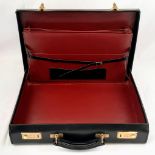 A Simpson of London Black Leather Attaché Case. Unused but some small signs of shop wear and tear.