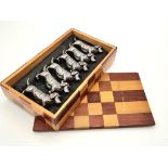 Six white metal dog dachshund knife rests. Comes in a wooden oriental box. Metal dog - 49 grams