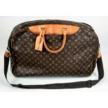 A Louis Vuitton Monogram Alize 24Hr Boston Bag. Shoulder strap. Brown leather handles. Cloth