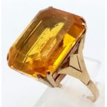 A 9K Yellow Gold Citrine Ring. Large rectangular central stone. 7.17g total weight. Size L.