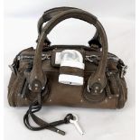 A Chloe Brown Leather Handbag. Padlock with key. Silver-toned hardware. White cloth interior with