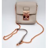 A Ted Baker Leather Handbag. Rose gold plated hardware and strap. Very good condition but please see