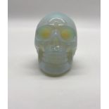 A Fire Opalite Hand-Carved Skull Figure. A perfect small ornament or paperweight. 5 x 4 cm.