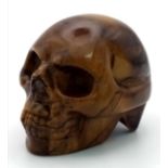 A Hand-Carved Tigers Eye Crystal Skull Figure. Perfect as an ornament or small paperweight. 5 x 4cm