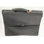 A Simpson of London Silver Carbon Leather Briefcase. 16 x 13 inches. Unused, but some small signs of