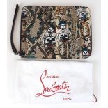 A Christian Louboutin Folder Clutch Bag. Day of the dead decoration. Red leather interior with